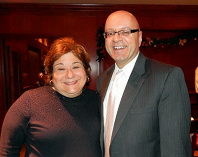 Elizabeth Z. Bartz, President and CEO with Joseph May, Social Media Manager at the Holiday Party.