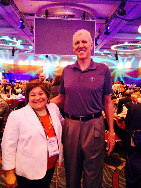 Elizabeth Bartz photographed here with NBA great, Bill Walton, [at 6'11"] formerly of the Boston Celtics.