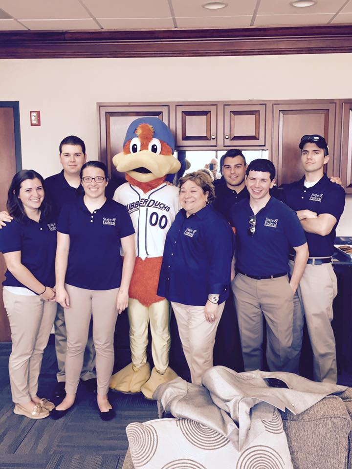 Team Intern with RubberDucks mascot, Webster and Elizabeth Bartz, President and CEO of State and Federal Communications.